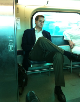 Illustration for article titled A Dejected Tom Ricketts Rides The Train